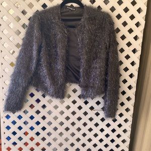 Beautiful dressy short black jacket.  Size Small. Express brand.
